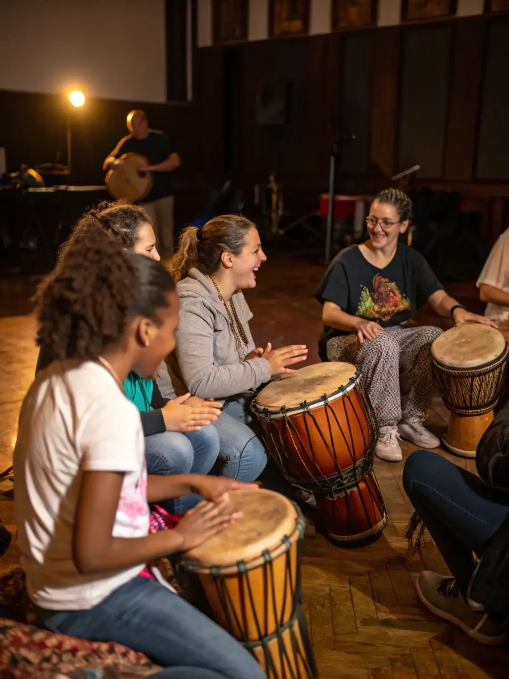 A captivating shot of a diverse group of individuals participating in a drumming circle, creating rhythmic beats and connecting through the shared experience of music-making.